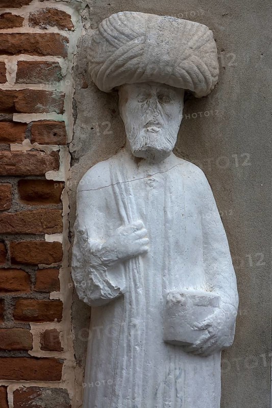 Detail of the marble statue of a merchant family from the 13th and 14th century, Campo dei Mori in the Cannaregio district, Venice, Veneto, in the district of Cannaregio, Venice, Veneto, Italy