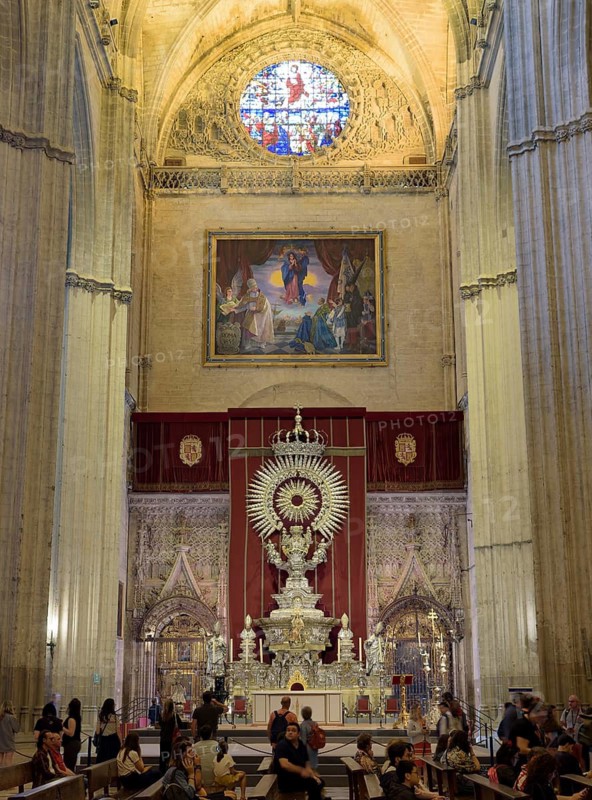 Church altar with impressive vault and colorful stained-glass window in Gothic style, Seville, Andalusia, Spain
