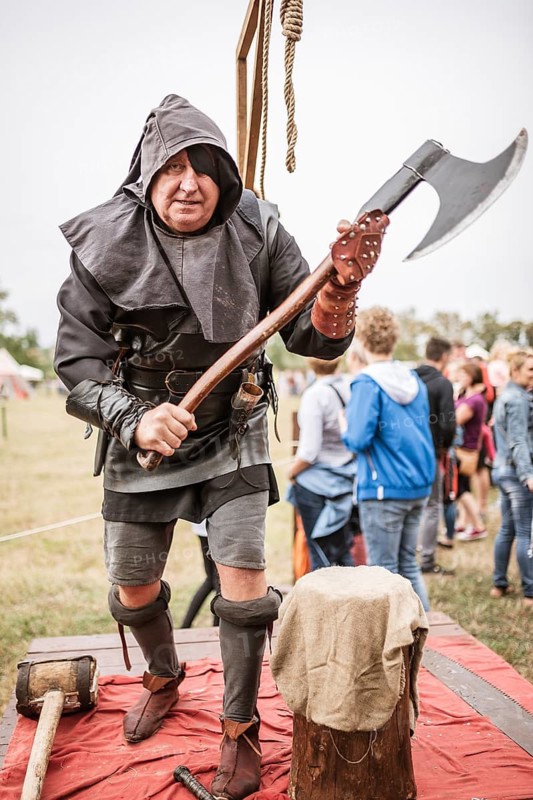 LUBIAZ, POLAND - AUGUST 25, 2018: Monastery Siege - Medieval executioner with the big ax