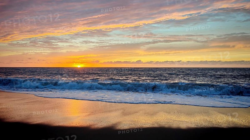 A bright sunset spreads warm colors over the sea and ends at the horizon, hiking, Tarrafal de Monte Trigo, Santo Antao, Cabo Verde, Cape Verde, Cape Verde
