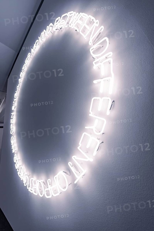 A circle of glowing neon letters on the wall creates a modern work of art, Schauwerk Sindelfingen, Germany