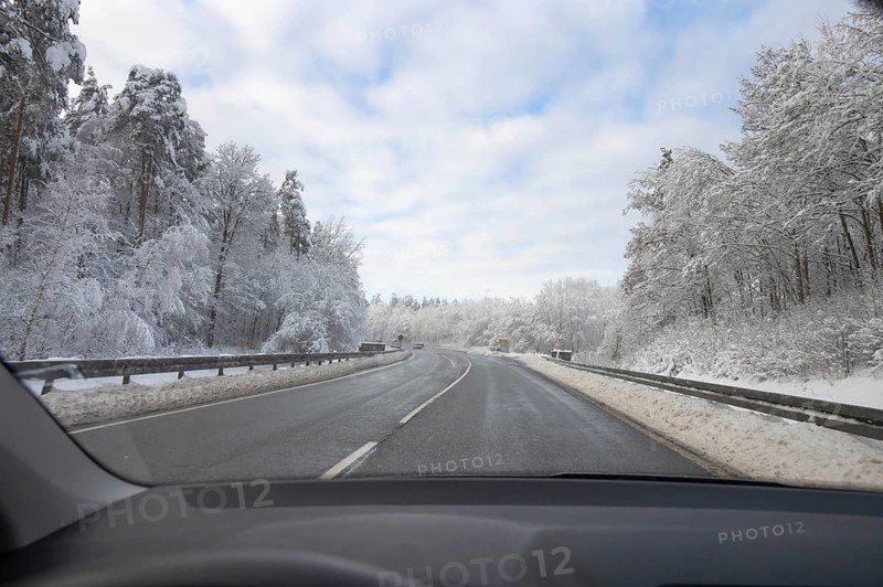 View from car, snowy landscape with cleared federal road, Heroldsberg, Middle Franconia, Bavaria, Germany