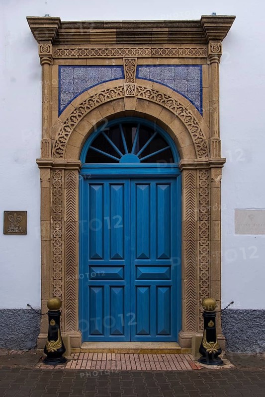 A blue door with a classic arch and detailed geometric patterns, Essaouira, Morocco