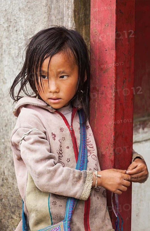 SAPA, VIETNAM, JUNE 10, 2011: Unidentified vietnamese girl in Ta Van village. Though Vietnam's economic growth rate is among the highest in the world, poverty rate is still high
