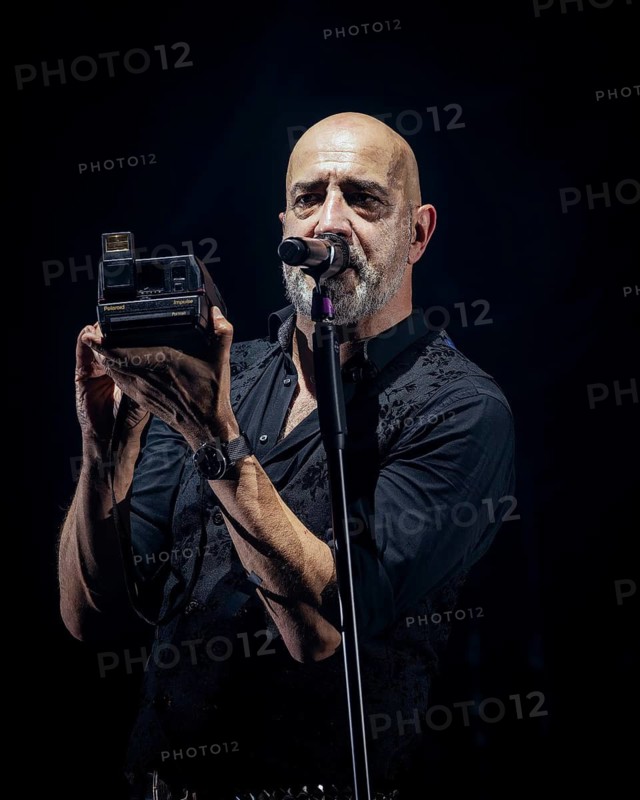 Alexander Wesselsky, singer of Eisbrecher with Polaroid camera live on Kaltfront Tour 2025 Tour in Berlin Columbiahalle on 15.05.2025