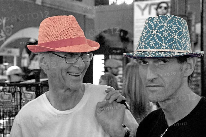 Young men poke hats for fun in a department store, Schwarz Weiss, New Yoprk, USA