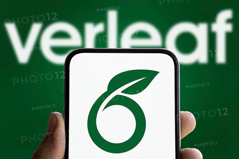 Overleaf logo is displayed on smartphone. Overleaf is a cloud-based LaTeX editor for scientific writing and publishing.