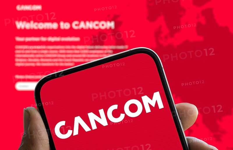 CANCOM logo is displayed on smartphone. Cancom SE is a German company for IT services.
