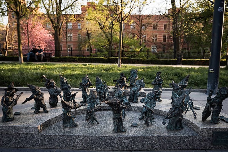 WROCLAW, POLAND - APRIL 22, 2023: Statue of dwarves representing philarmonic orchestra of Poland located in front of the building National Forum of Music.