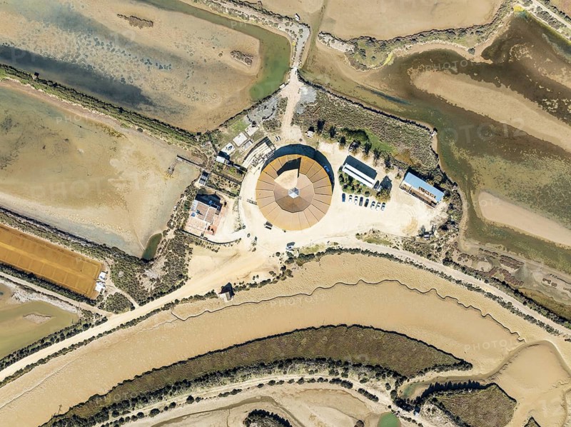 The Natural Resources Center of the Salinas de Chiclana saltworks near Chiclana de la Frontera. Aerial view. Drone shot. Bahía de Cádiz Nature Reserve, Cádiz province, Andalusia, Spain