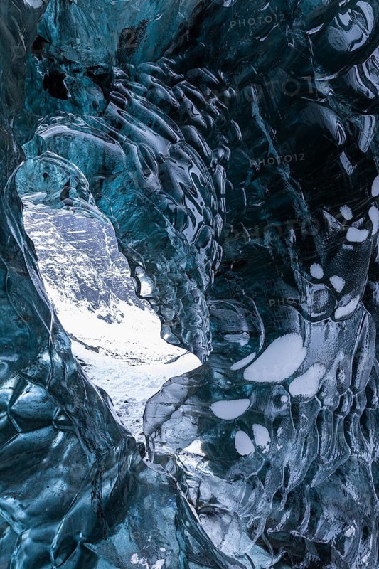 Ice cave open to the top with snow-covered ice combs, Pröng ice cave, Sudurland, Iceland