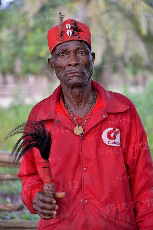Village elder of Nkala wearing the typical red robe, Nkala, Bandundu Province, Democratic Republic of the Congo