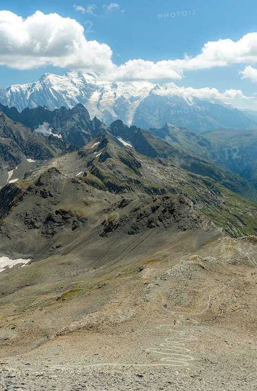 Beautiful summer scenery in the French Alps, featuring majestic peaks, rugged terrains, and expansive views near Chamonix and Mont Blanc under a clear blue sky