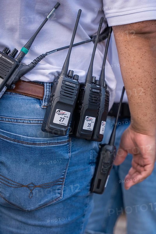 Close-up of radios in the belt pouch of a security guard, Malleparty Böblingen, Germany
