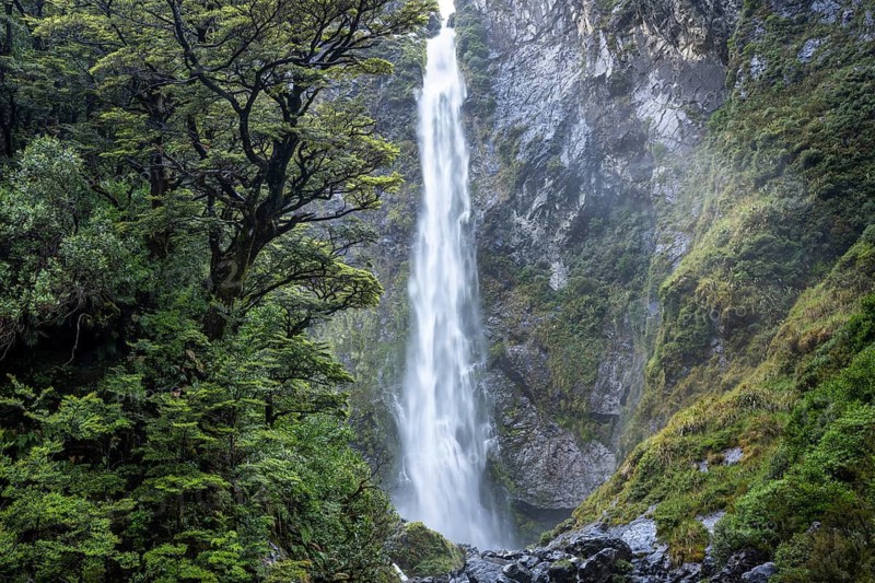 The Devils Punchbowl waterfall falls down a rock face. Arthurs Pass National Park, Canterbury South Island, New Zealand