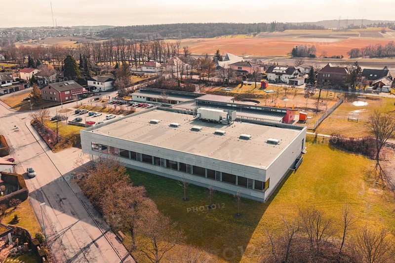 Industrial building surrounded by fields and trees in a rural area, Ötisheim, Enzkreis, Germany