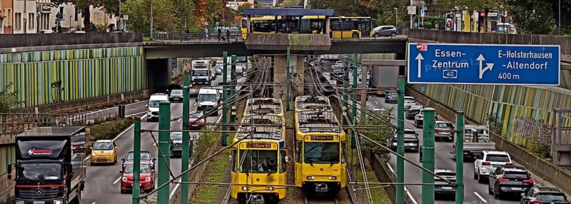 Lots of traffic on the A 40 motorway on four lanes and two subways on two lanes and a bus on the bridge, infrastructure, Essen, Ruhr area, North Rhine-Westphalia, Germany