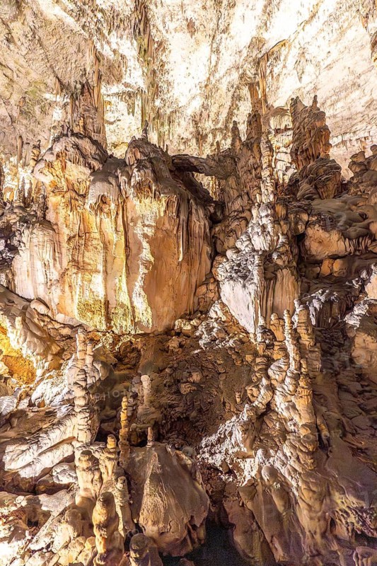 Majestic stalactites and stalagmites create a breathtaking spectacle in postojna cave, slovenia, a popular tourist destination