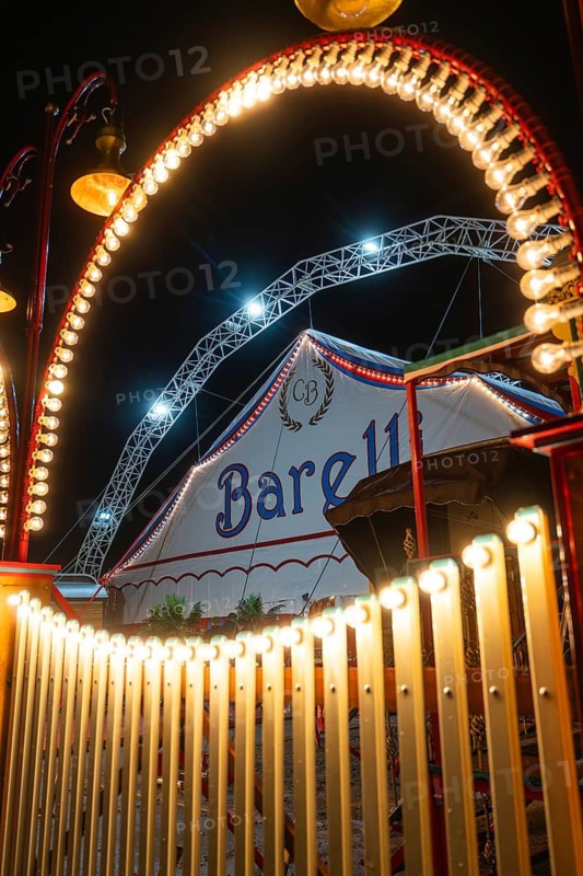 Illuminated arches and circus tent with lights at night, Böblingen, Germany