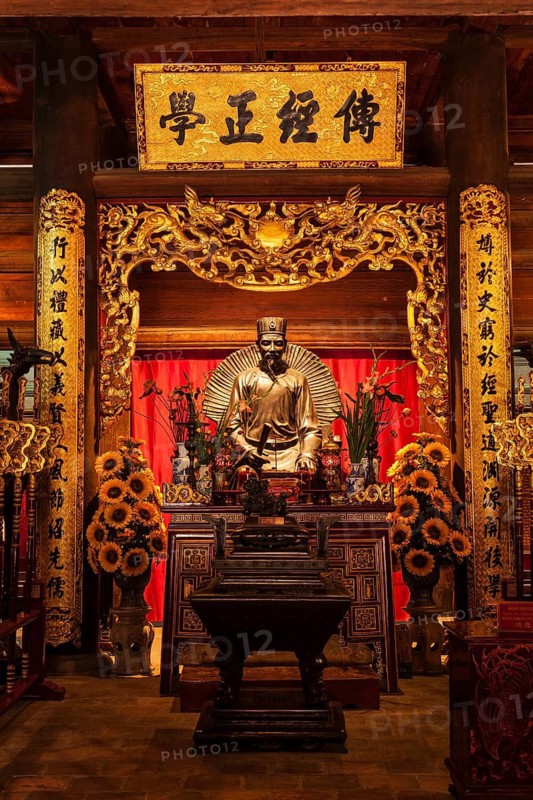 HANOI, VIETNAM, JUNE 11, 2011: Confucius statue at the Temple of Literature. This temple is dedicated to Confucius, sages and scholars