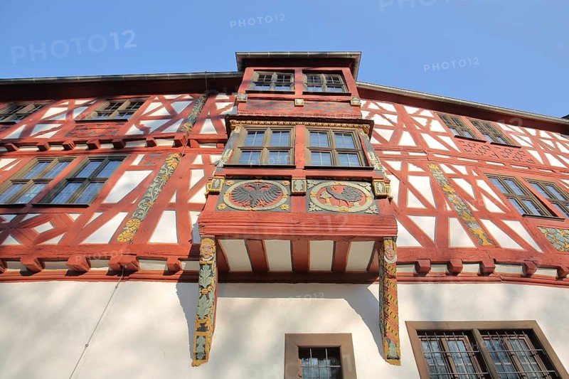 Bay window with decorations and wood carving on the historic courtyard, looking up, half-timbered house, landmark, Bad Camberg, Taunus, Hesse, Germany