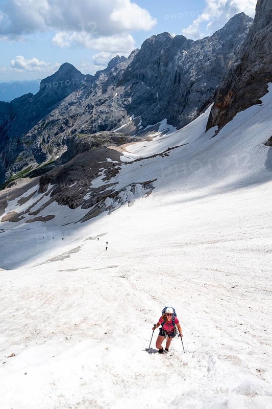 Mountaineer on a snowfield, mountain basin with glacier remnant of the Höllentalferner, Höllental, rocky mountain peaks, Höllental, Bavaria, Germany