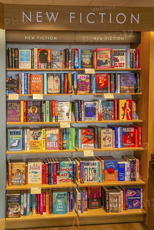 Bookshelves display of New Fiction books inside Waterstones bookshop, Sudbury, Suffolk, England, UK