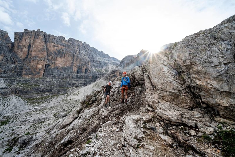 Two mountaineers in rocky mountain landscape, Via Ferrata SOSAT via Ferrata, Sun Star, Brenta Mountains, Trentino, Italy