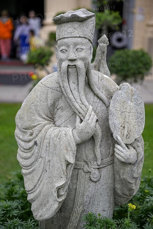 Stone statue of a Chinese warrior, guardian, Wat Phra Kaew, Temple of the Emerald Buddha, Bangkok, Thailand