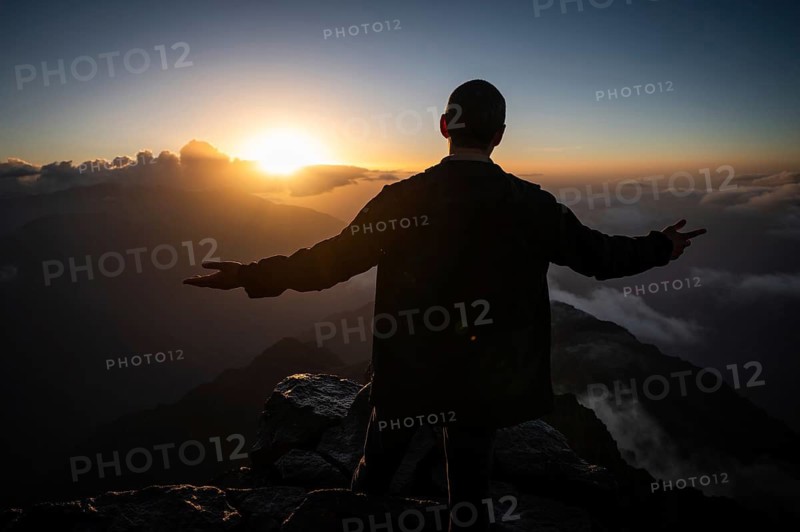 Man on the peak Toubkal, the highest mountain in North Africa during sunrise