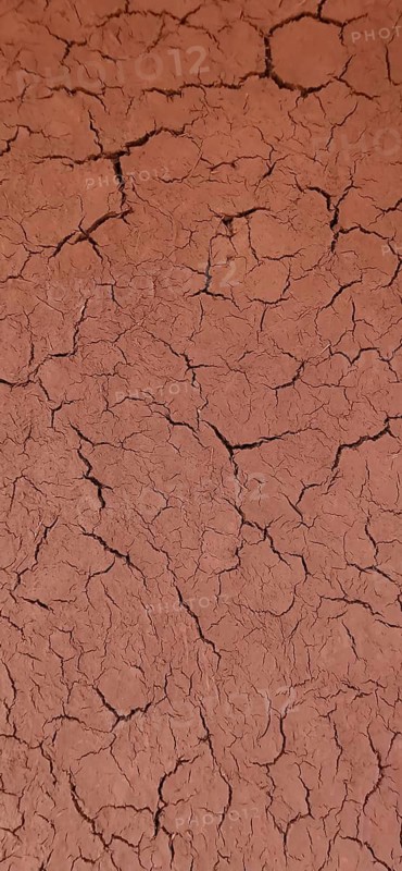 Close-up of dry, cracked soil in brown color, desert soil, Morocco