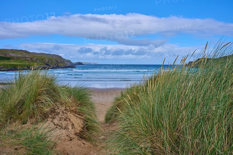 A passageway through the dunes leads to a sandy beach with views of the sea and sky, Farr Bay, Bettyhill, Thurso, Scotland, United Kingdom, Great Britain