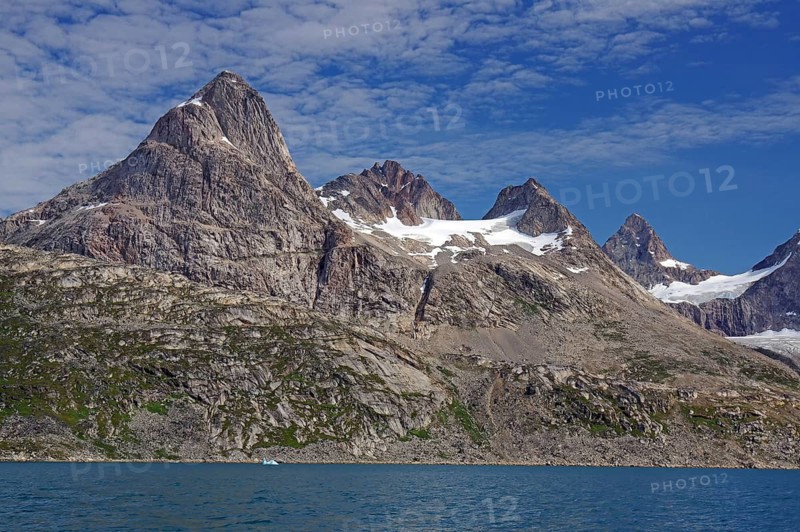 Numerous rugged peaks rise high above a rocky coastline, Tasilaq, Arctic, Greenland, Denmark