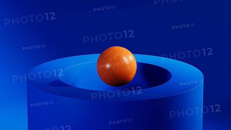 An orange sphere floats above a blue circular geometric shape, creating an intriguing abstract 3D design that captivates the viewer's eye