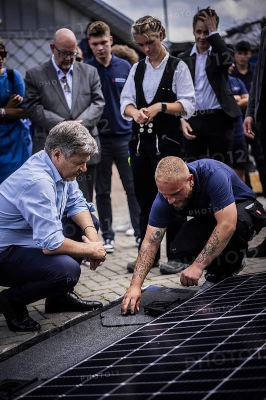 Federal Minister for Economic Affairs and Climate Protection Robert Habeck (Alliance 90/The Greens) on a summer tour of Germany. Here in Bochum, 10 July 2024, visiting a roofer with solar roof elements Photographed on behalf of the BMWK