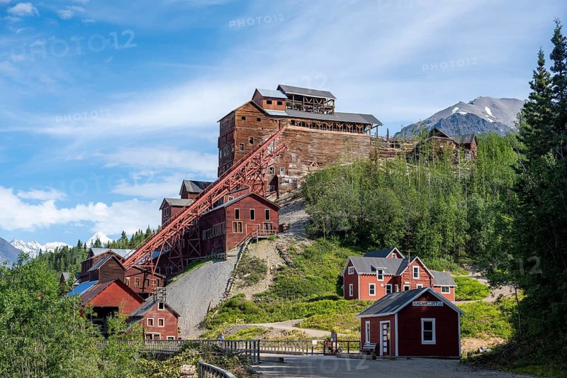 Red Kennicott buildings in front of mountainous landscape, Kennicott Concentration Mill to extract copper from quarried rock, Historic Kennecott Copper Mine, National Historic Landmark, Wrangell St. Elias National Park, Alaska, USA