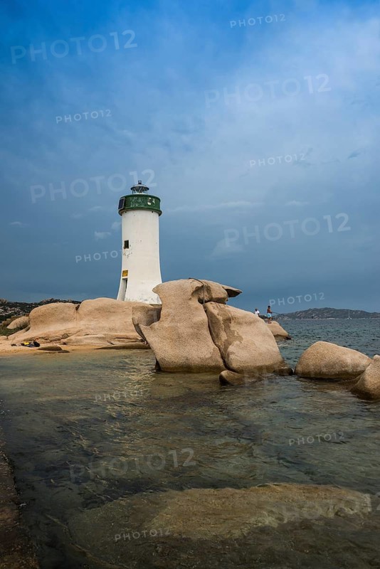 Lighthouse with beach and bizarre granite rocks, Spiaggia Porto Faro, Faro di Punta Palau, Palau, Costa Smeralda, Sardinia, Italy