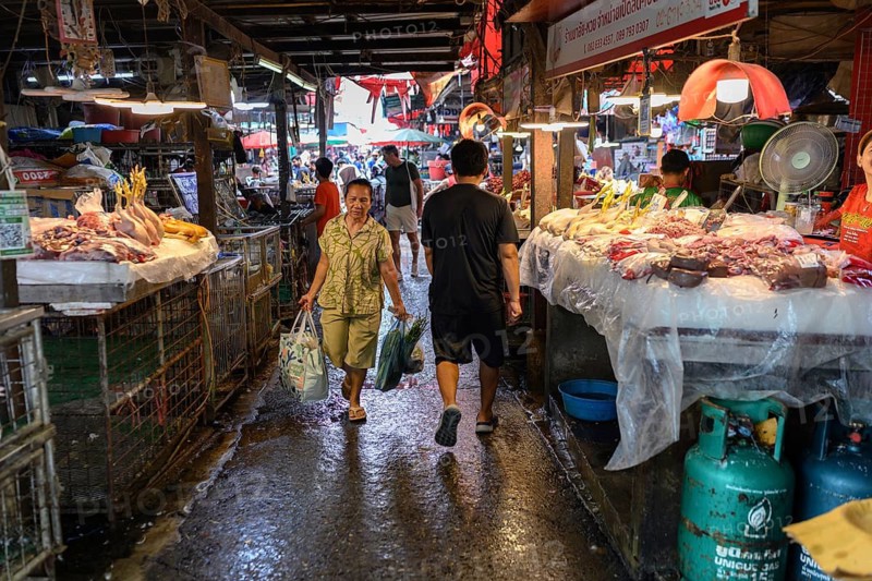Bangkok, Thailand. February 19th 2025. A Local Thai woman shopping at the Khlong Toei Market, Bangkok