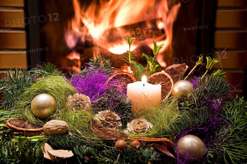 Christmas floral table decoration in front of the fireplace