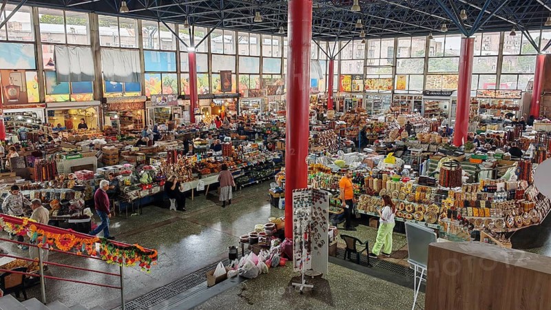 Large indoor market with numerous stalls and a variety of products, Armenia