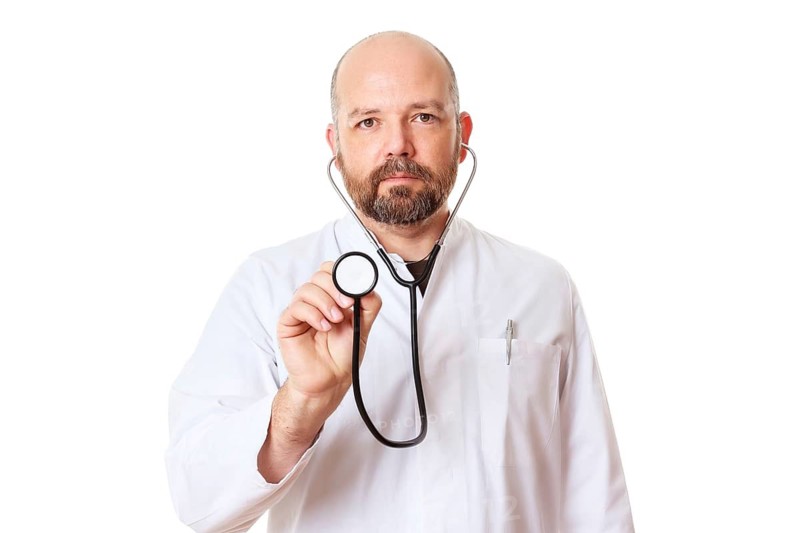 A doctor with a stethoscope, 40 years old, bearded, Bavaria
