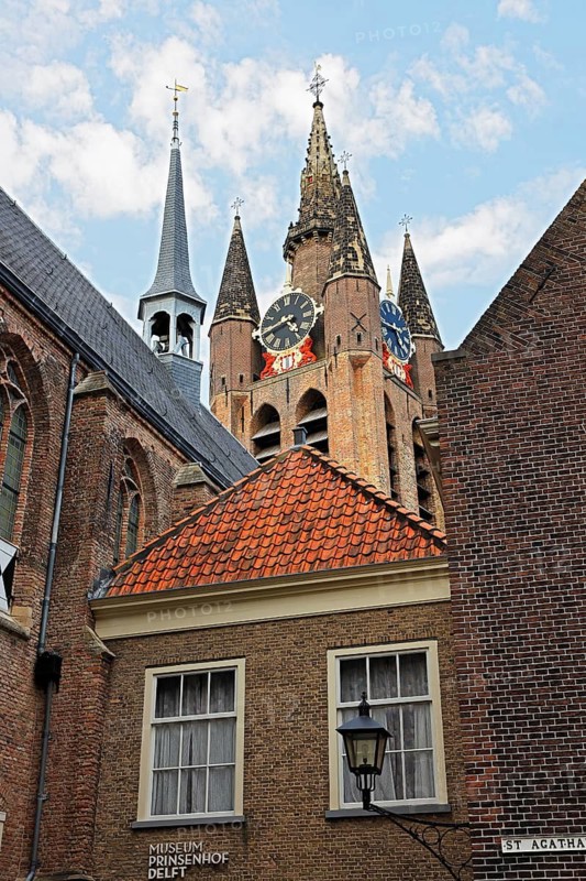 Historic city centre of Delft, Museum Het Prinsenhof in the former Sint Agatha monastery is dominated by the tower of the Gothic Old Church, Oude Kerk, Delft, Zuid-Holland, Netherlands