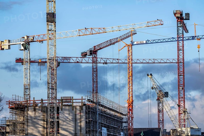Construction cranes on 2 large construction sites Wohnbau, Geschäftsgebäude, Krefeld North Rhine-Westphalia, Germany