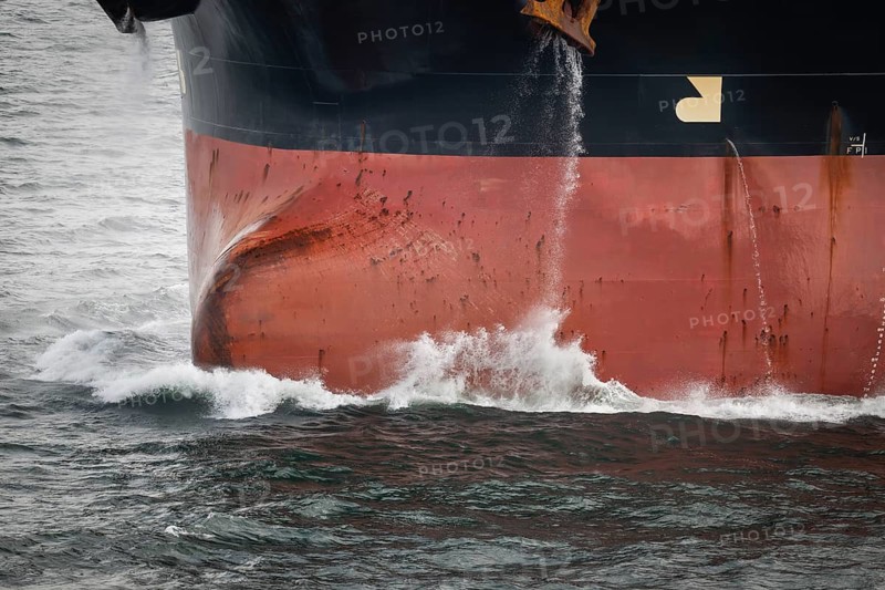 Close-up, bow of a tanker ship cuts through the sea and produces spray, overseas port, Rostock, Mecklenburg-Western Pomerania, Germany