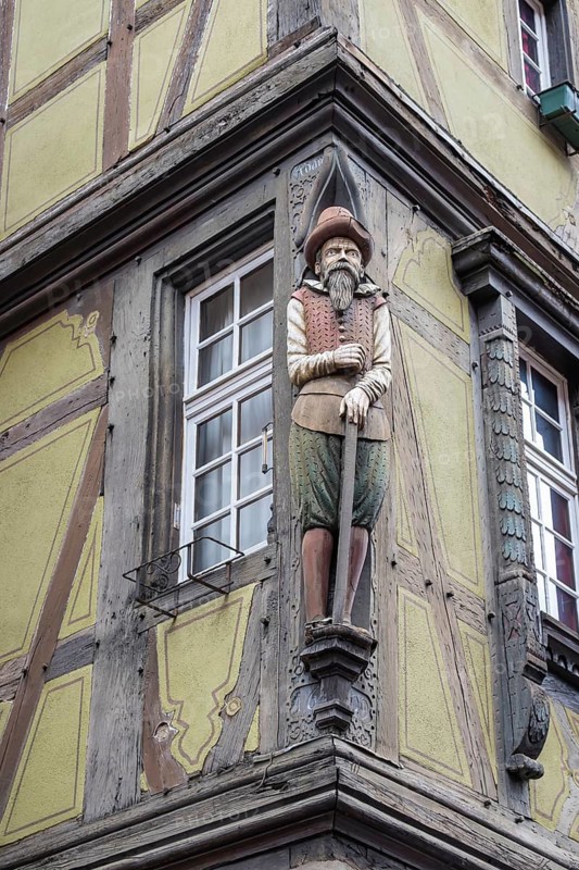 Wooden figure at the historic Maison Zum Kragen in the Rue des Marchands, Colmar, Alsace, France