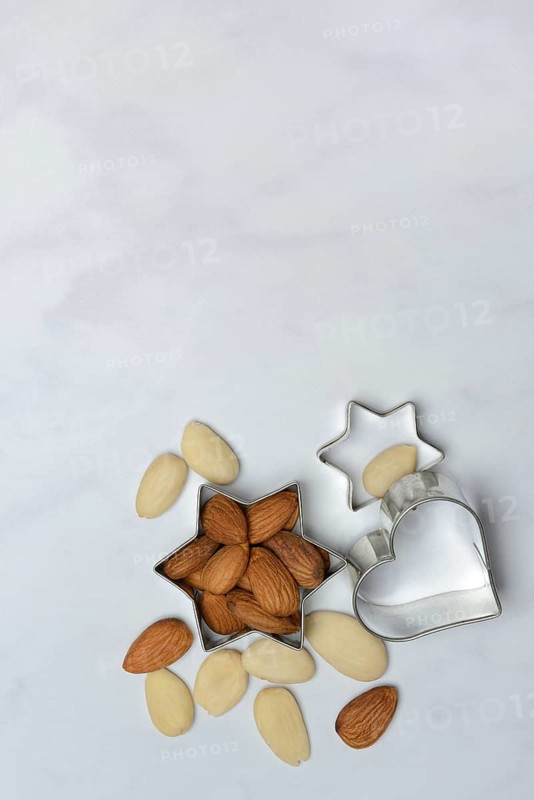 Almonds and biscuit cutters for biscuits, almond kernels
