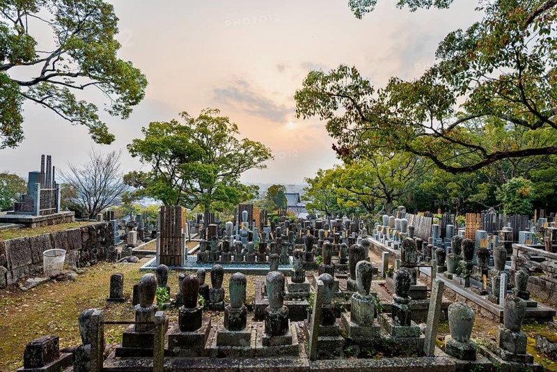 Tombstones at cemetery at sunset, Konkai-Komyoji Temple, Kurodanicho, Kyoto, Japan
