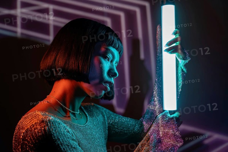 A futuristic Latin woman is immersed in a vibrant metaverse, surrounded by neon lights and digital interfaces, embodying a blend of technology and imagination