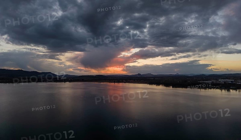 Aerial view, panorama of Lake Constance, Untersee near Radolfzell after sunset, on the horizon the Hegauberge Hohentwiel, Hohenstoffeln and Hohenhewen, district of Konstanz, Baden-Württemberg, Germany