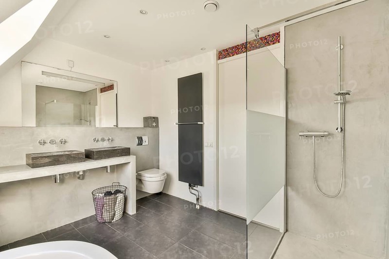 Stylish modern bathroom featuring sleek fixtures, minimalist decor, and elegant tiling for a contemporary feel